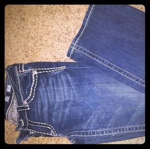 White-embroidered, boot-cut jeans